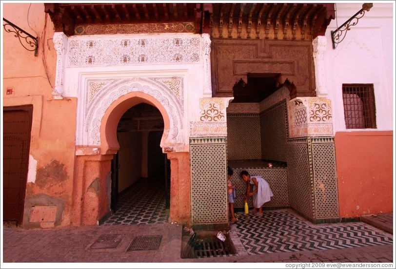 Two girls and a fountain in the Medina.