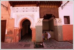 Two girls and a fountain in the Medina.