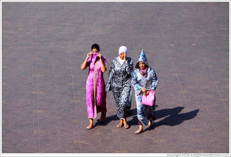Three women walking, Jemaa el Fna.