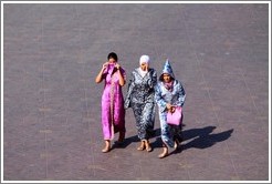 Three women walking, Jemaa el Fna.