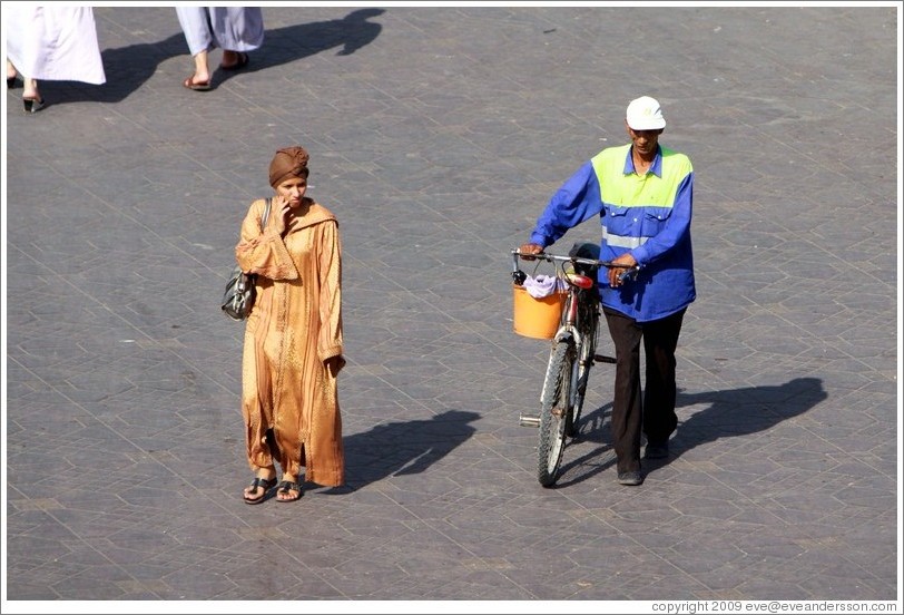 Woman and man with a bike, Jemaa el Fna.