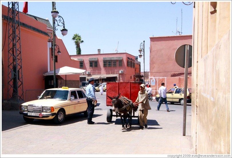 Taxi and man with a donket in the Medina.