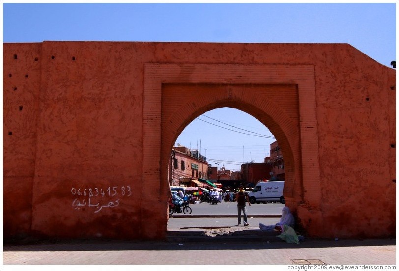 Wall surrounding the Medina, with 06.68.3415.83 written on it.