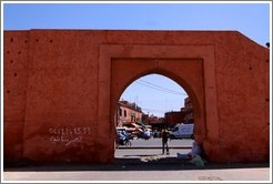 Wall surrounding the Medina, with 06.68.3415.83 written on it.