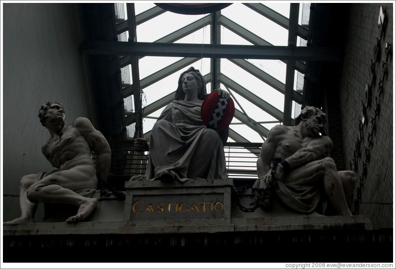 Castigatio. Sculpture of woman punishing two criminals.  Kalverstraat, Centrum district.