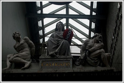 Castigatio. Sculpture of woman punishing two criminals.  Kalverstraat, Centrum district.