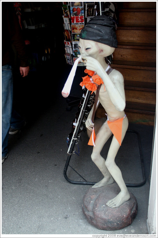 Alien using drugs, storefront, Centrum/Red Light district.