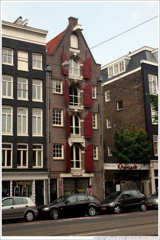 Building with red shutters and Manzano Restaurant.  Rozengracht, Jordaan district.