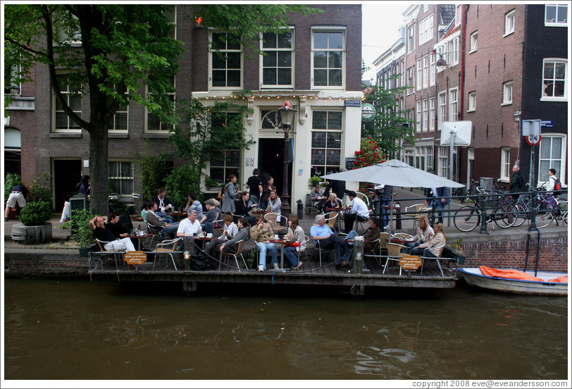 Restaurant with floating outdoor patio.  Egelantiersgracht canal, Jordaan district.