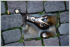Sculpture of hand and breasts embedded in sidewalk.  Red Light district.