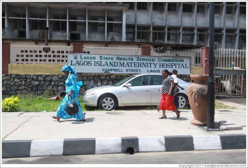 Women walking past the Campbell Street Lagos Island Maternity Hospital.