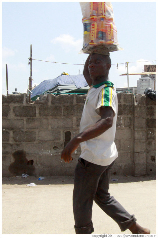 Man carrying Boost on his head.