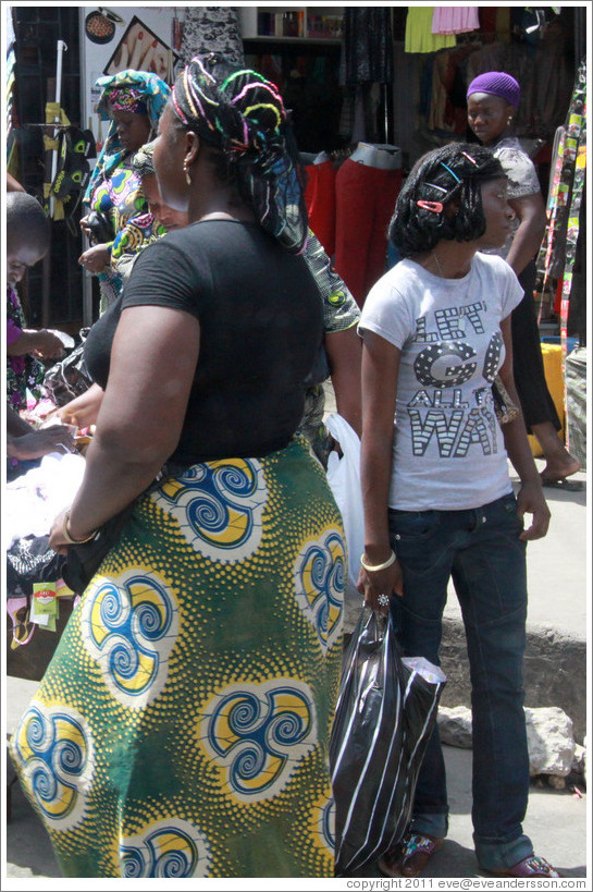 Woman with scarf. Girl with barrettes. Lagos Island.