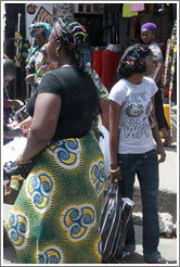 Woman with scarf. Girl with barrettes. Lagos Island.