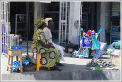 Two women and a pile of rocks. Lagos Island.