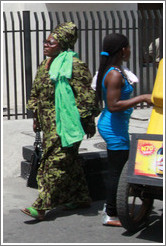 Woman in green. Girl is blue.