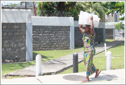 Woman with a box on her head.