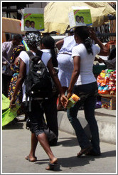 Two women with Tetmosol boxes.