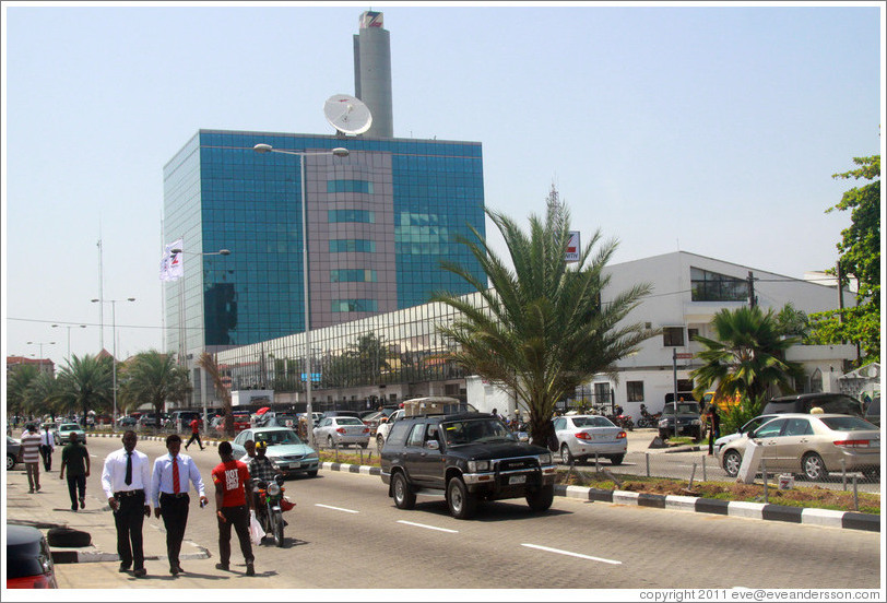 Businessmen walking down Ajose Adeogun Street, Victoria Island.