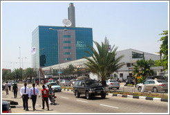 Businessmen walking down Ajose Adeogun Street, Victoria Island.