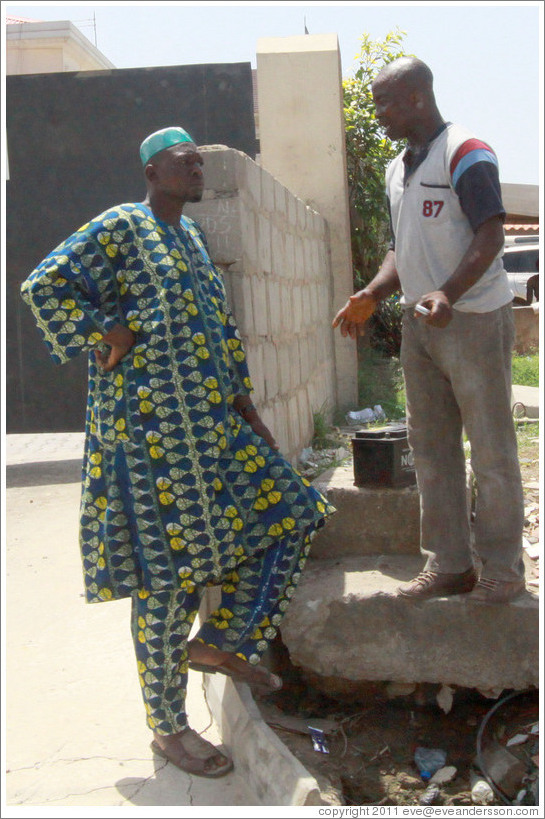 Two men talking. COD Church Road,  Victoria Island.