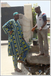 Two men talking. COD Church Road,  Victoria Island.