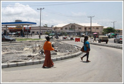 Two women walking. Lekki-Epe Expressway, Victoria Island.