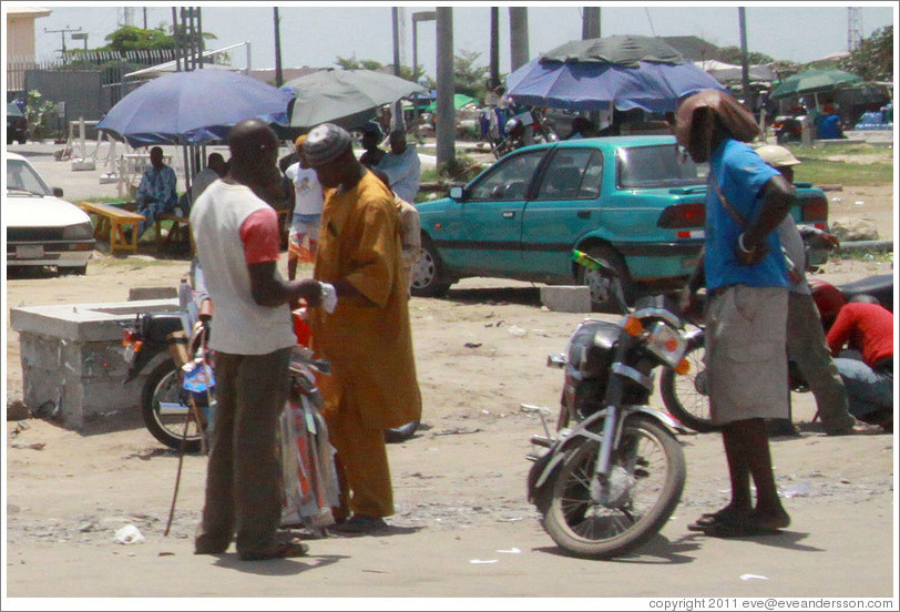 People at the side of the road, Lekki-Epe Expressway, Victoria Island.
