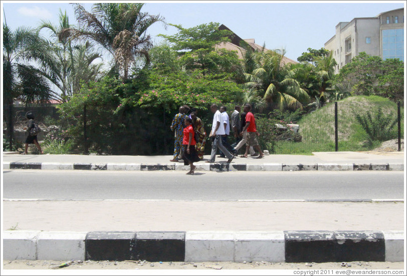 People walking. Maroko Road, Victoria Island.