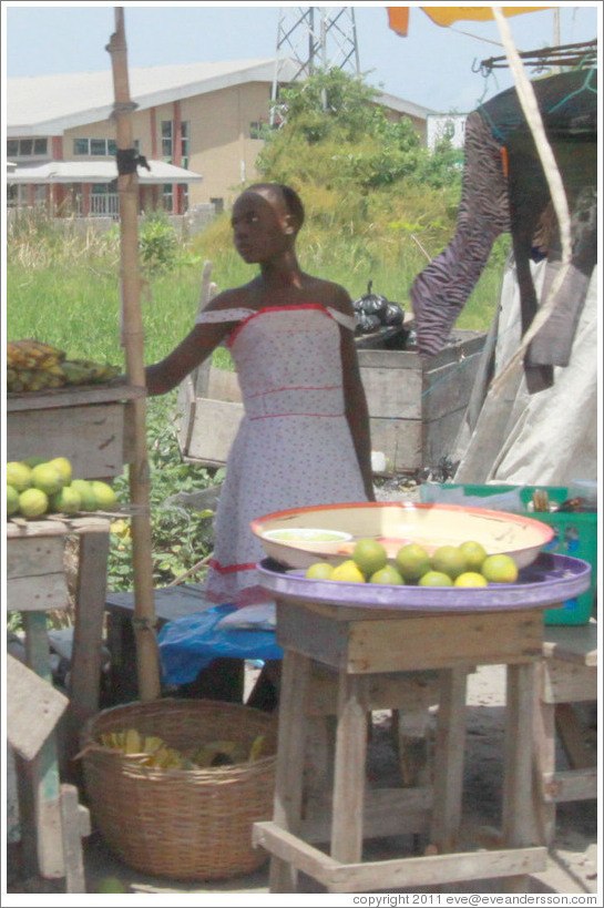 Girl selling fruit. Victoria Island.