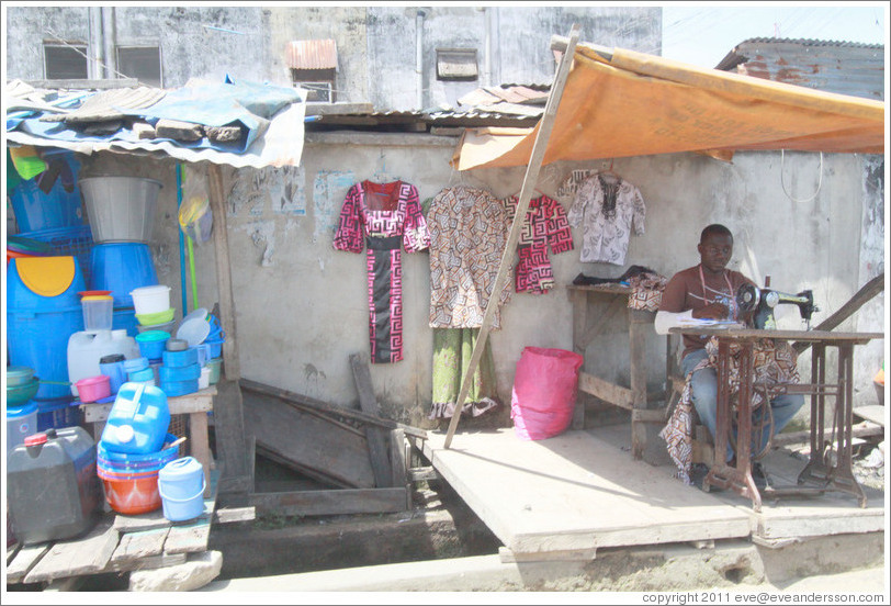 Roadside tailor. Victoria Island.