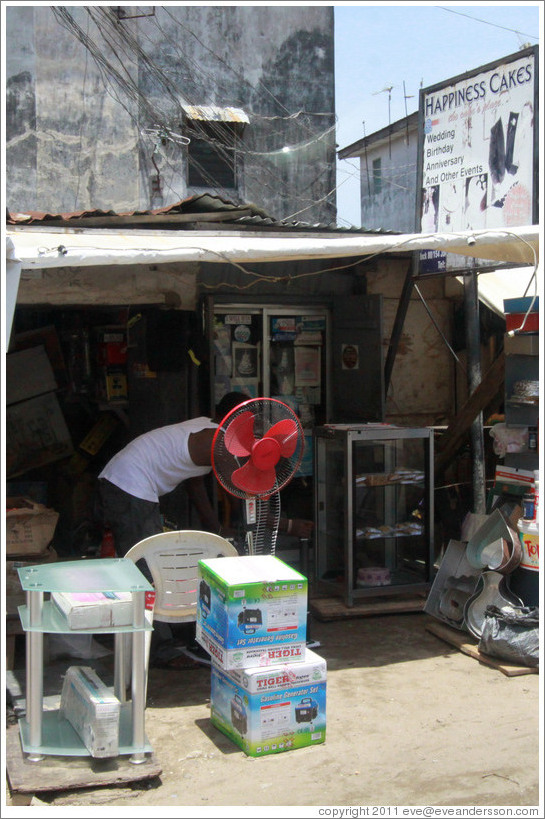 Red fan in front of store, Victoria Island.
