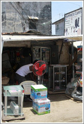 Red fan in front of store, Victoria Island.