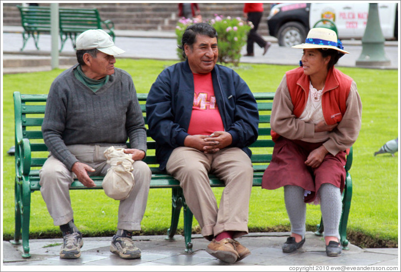 Two men and a woman on a bench, Plaza de Armas.