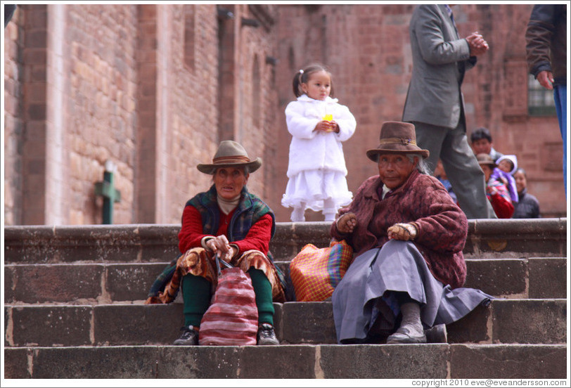 Two women and a girl, steps in front of the Cathedral, Plaza de Armas.