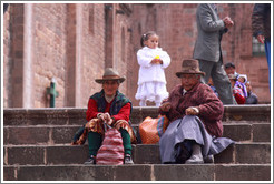 Two women and a girl, steps in front of the Cathedral, Plaza de Armas.