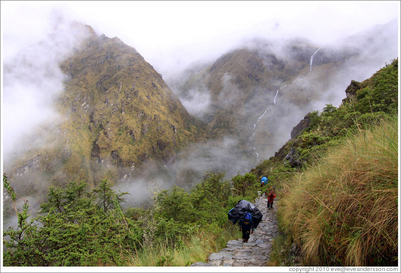 Porters climbing the steps of the Inca Trail.