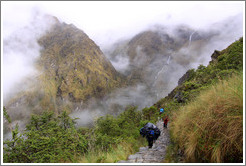 Porters climbing the steps of the Inca Trail.