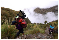 Porters climbing the steps of the Inca Trail.