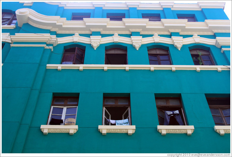 Green building with clothes hanging in the window, Pasaje Jos?laya, Historic Center of Lima.