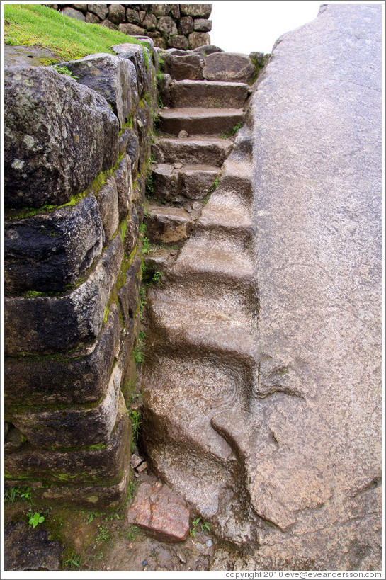 Stairs, partly carved into large stone. Machu Picchu.