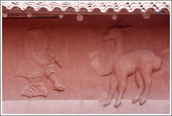 House near the Puca Pucara ruins, with a relief of a man and an alpaca.