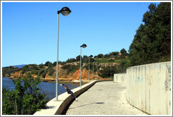 Child looking out to the sea, coastal path, Alvor.