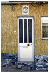 Door with tile depicting Nossa Senhora da Piedade (Our Lady of Piety) above it.