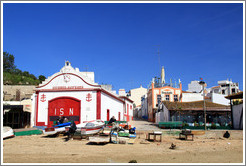 Shore, with fishing boats.