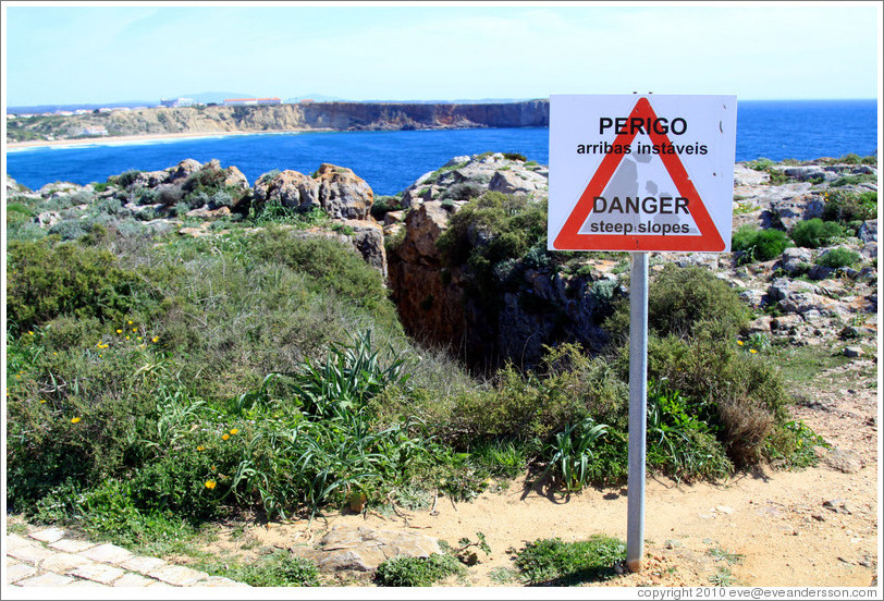 Sign reading "Perigo arribas inst?is", which loosely translates as "Come this way for a great photo op."  Fortaleza de Sagres (Sagres Fortress).