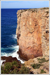 A barely visible fisherman fishes from this tall cliff at the Fortaleza de Sagres (Sagres Fortress).