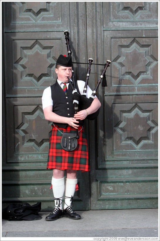 Bagpipe player.  High Street.