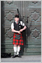 Bagpipe player.  High Street.