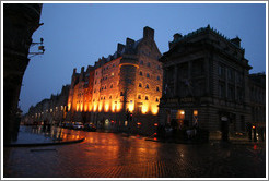 Bank Hotel and SAS Radisson Hotel, lit up in the pre-dawn, with light snow falling.  High Street.  Old Town.